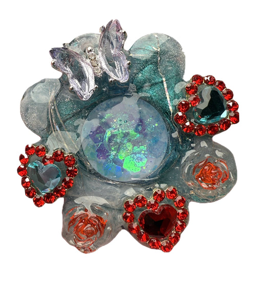 Decorative tag for dogs with opal style center, red gemstones, and floral elements on a white background