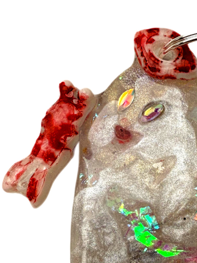 dog jewel tag ghost shape with a glittery pearlescent design and colorful gemstones on a white background