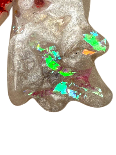 dog jewel tag ghost shape with a glittery pearlescent design and colorful gemstones on a white background