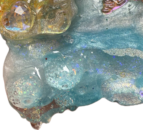 Close-up of a textured surface with blue and gold colors